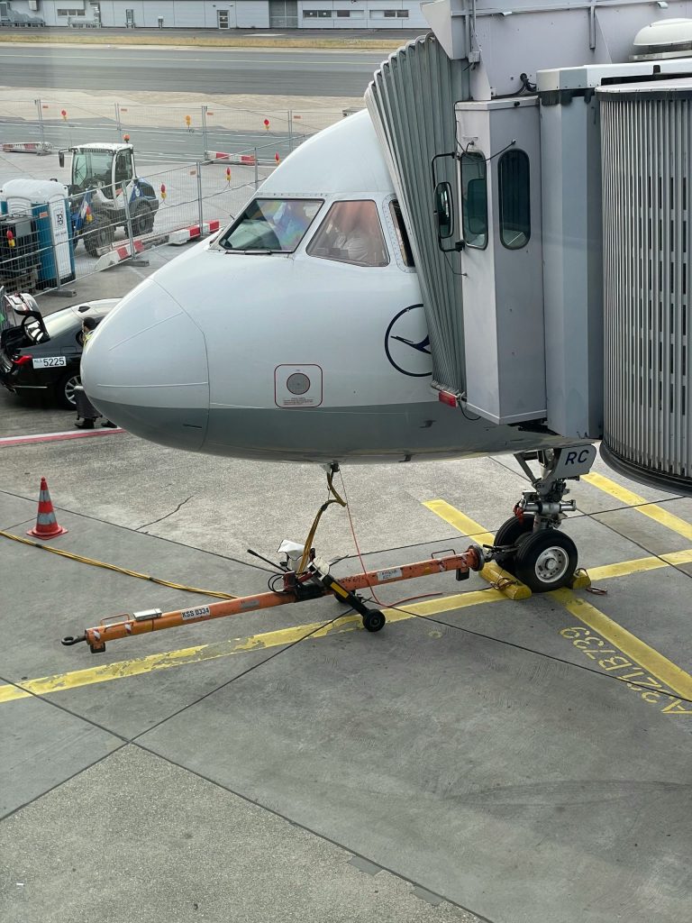 an airplane is parked on the tarmac at the airport
